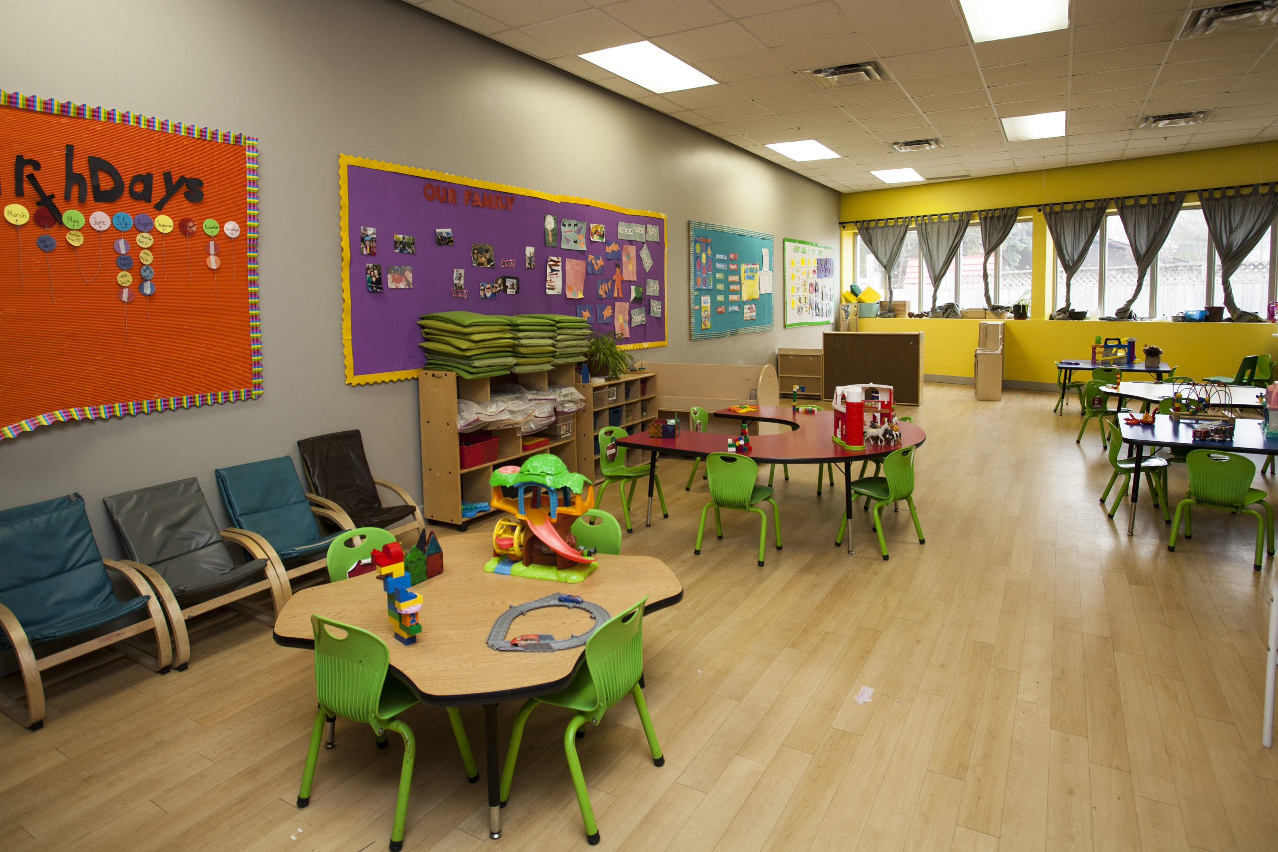 preschool classroom with tables and toys
